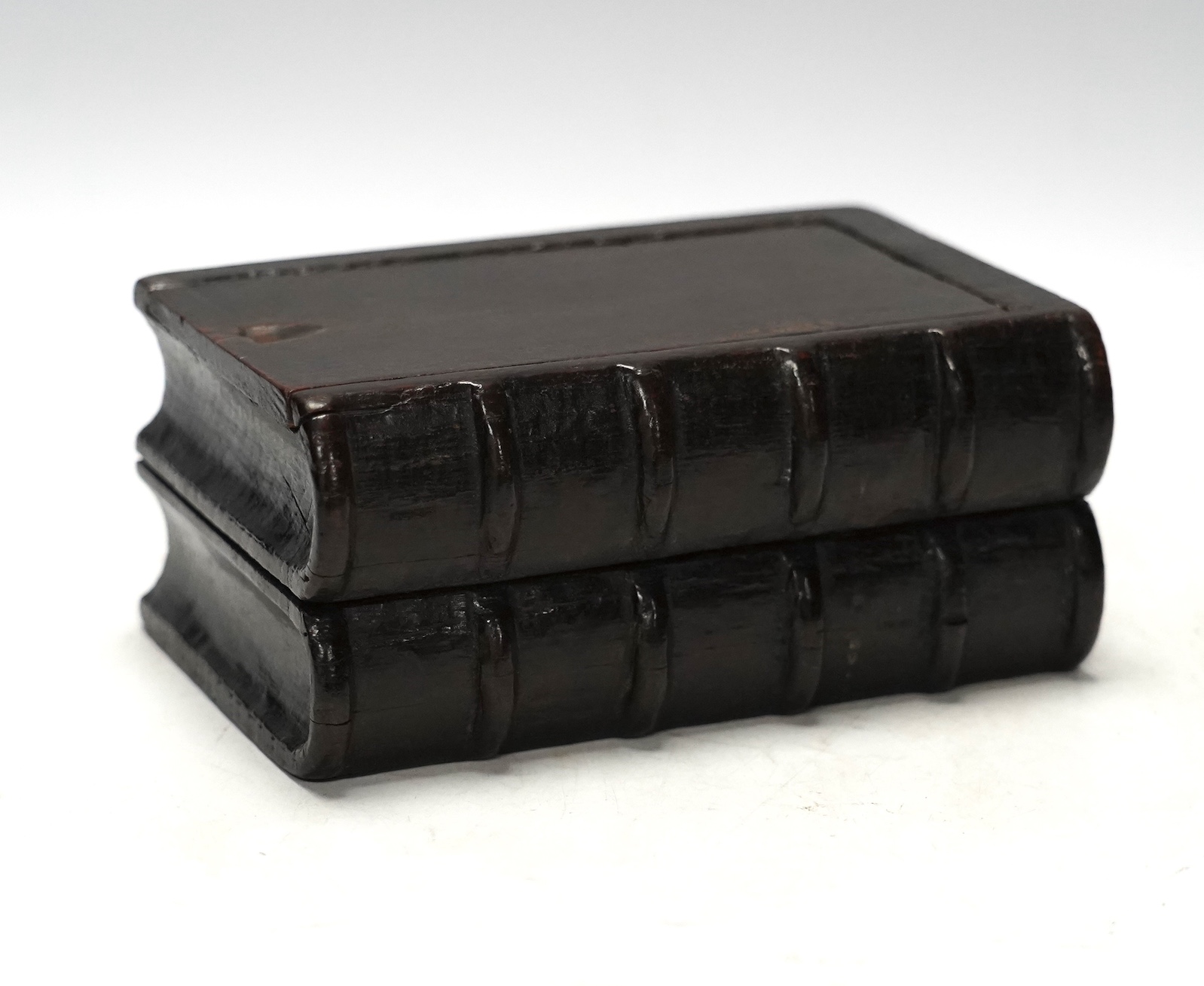 A 19th century novelty treen coin box in the form of two antiquarian books, 15.5cm